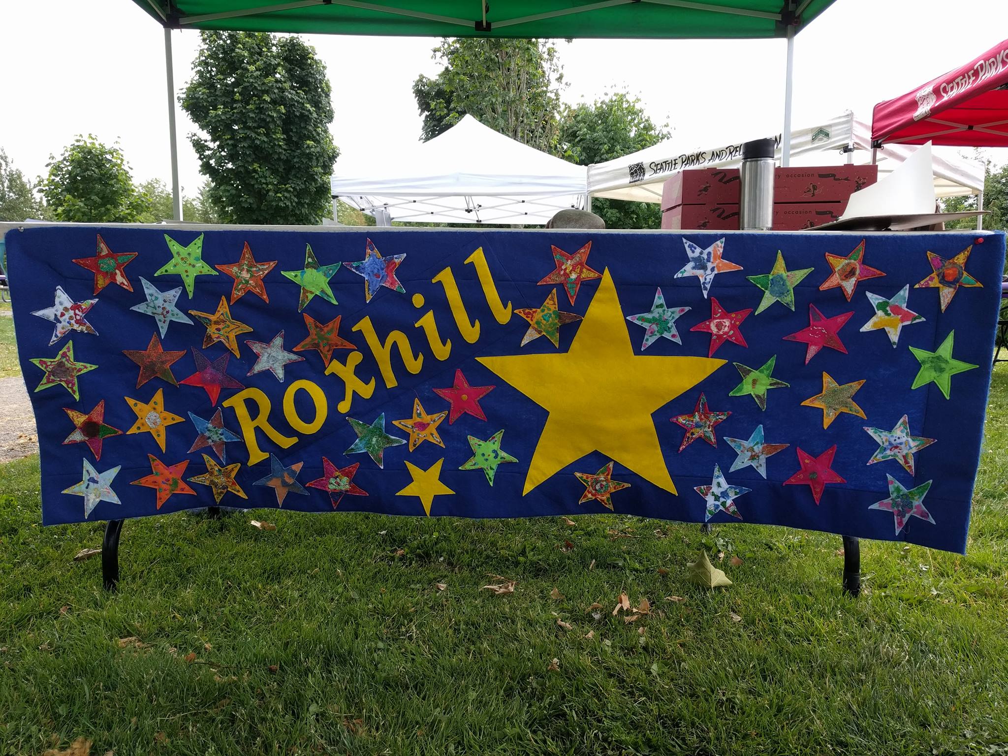 Quilt with lots of start, giant yellow star and "Roxhill"