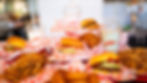 A mound of burgers, fries, and milkshakes